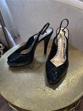 BCBGirls black snakeskin open toe heels